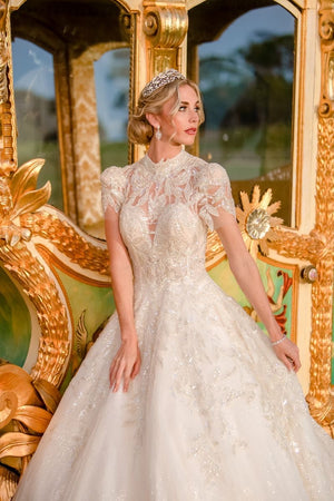 Woman in a white wedding dress standing in front of a golden carriage (bridal makeup) — Voodoo Makeup, Katy/Houston, TX