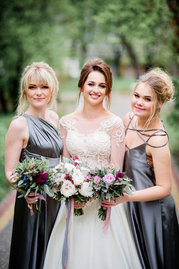 Bride with two bridesmaids holding bouquets outdoors — Voodoo Makeup (Katy/Houston, TX)