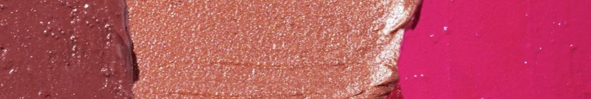 Close-up of Voodoo Makeup high-pigment cosmetic swatches in rich brown, bronze, and vibrant pink shades in Katy, Texas.
